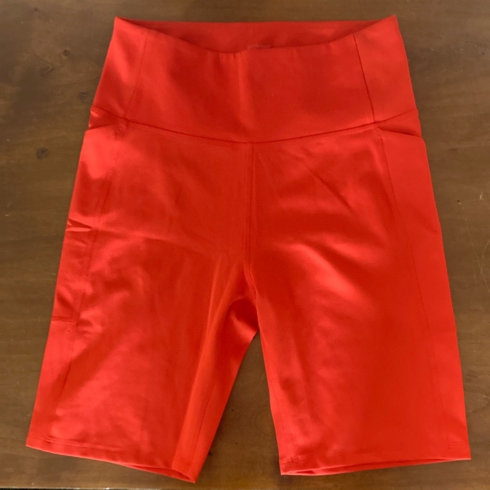 NEW WITHOUT TAGS GIRLFRIEND COLLECTIVE BLOOD ORANGE BIKE SHORTS WITH POCKET